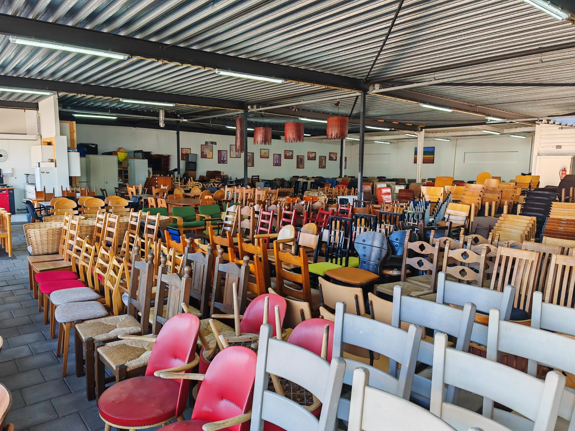 Collection of large amount of chairs in a showroom